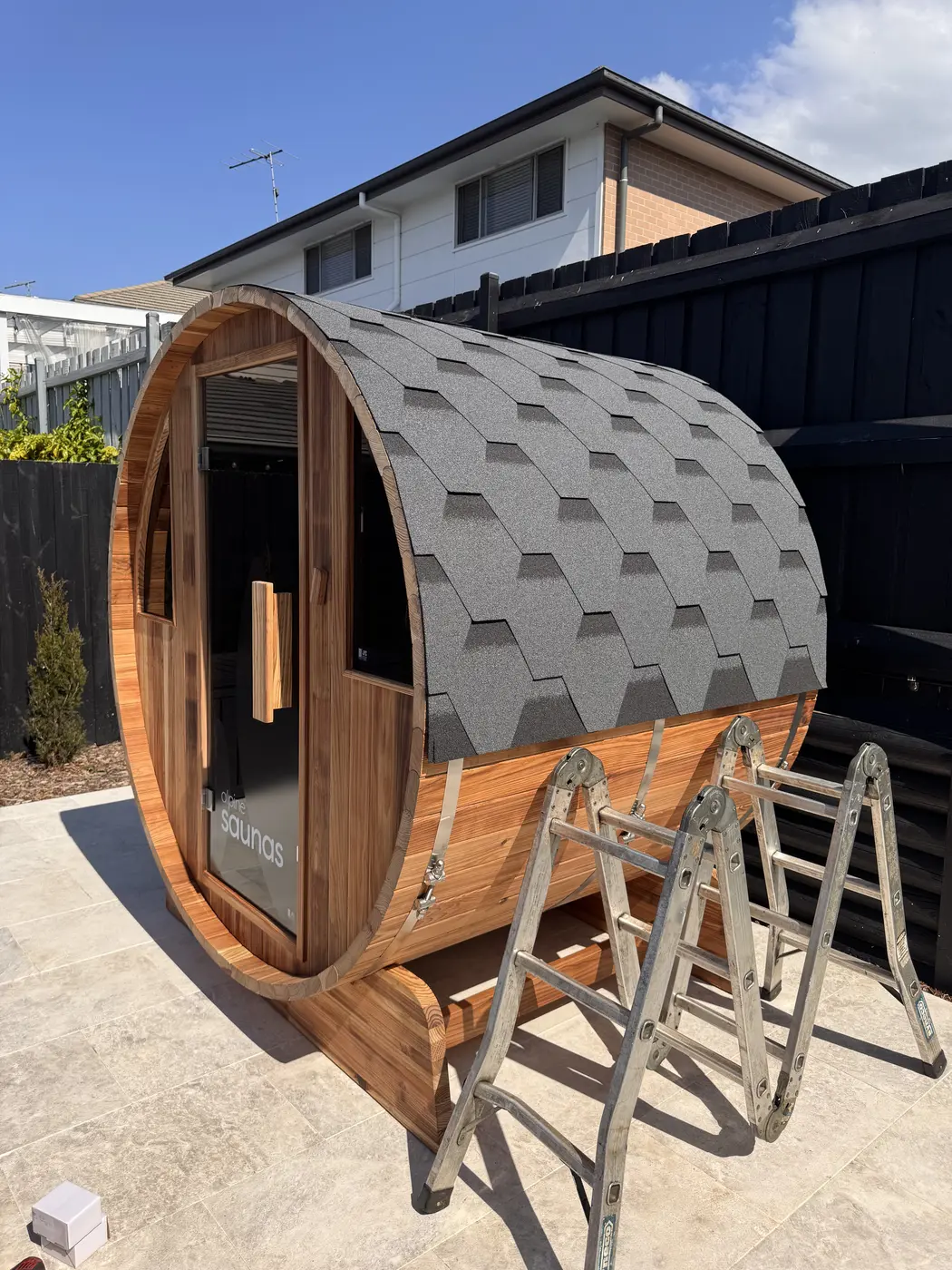 Outdoor barrel sauna wired with a dedicated circuit by BPE Solutions