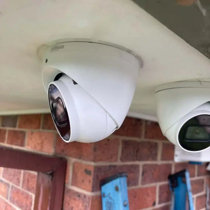 Dome cameras mounted under the eave