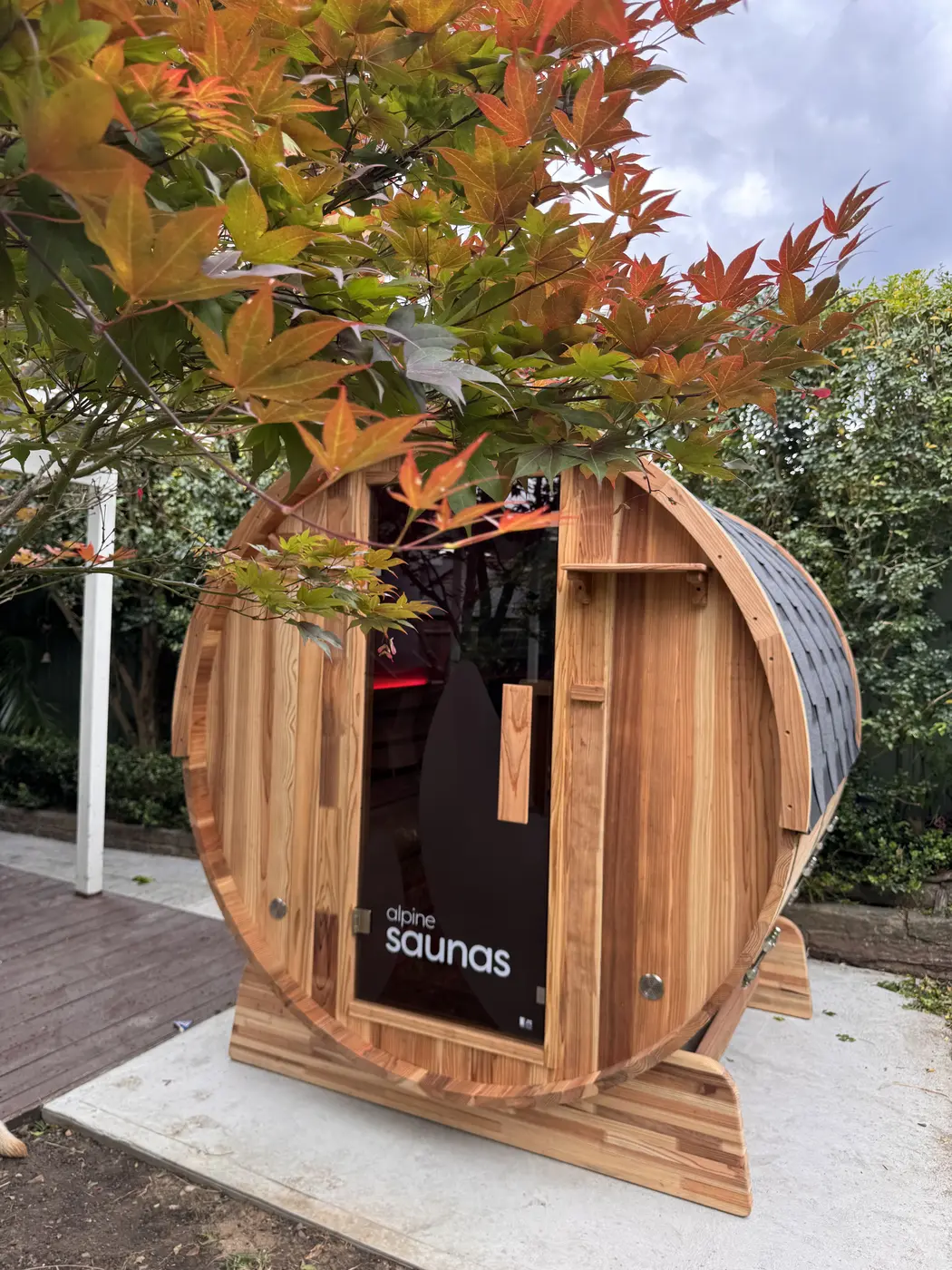 Cedar barrel sauna connected to a dedicated sauna circuit