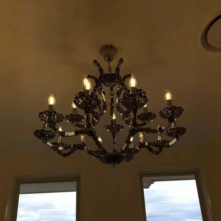 Chandelier installation in a living room