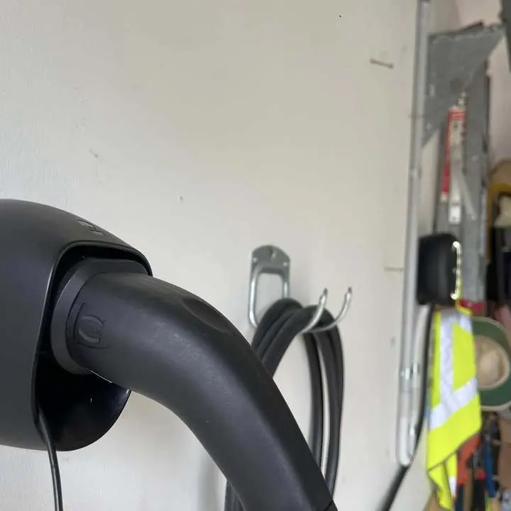 EV charger cable neatly stored in a garage