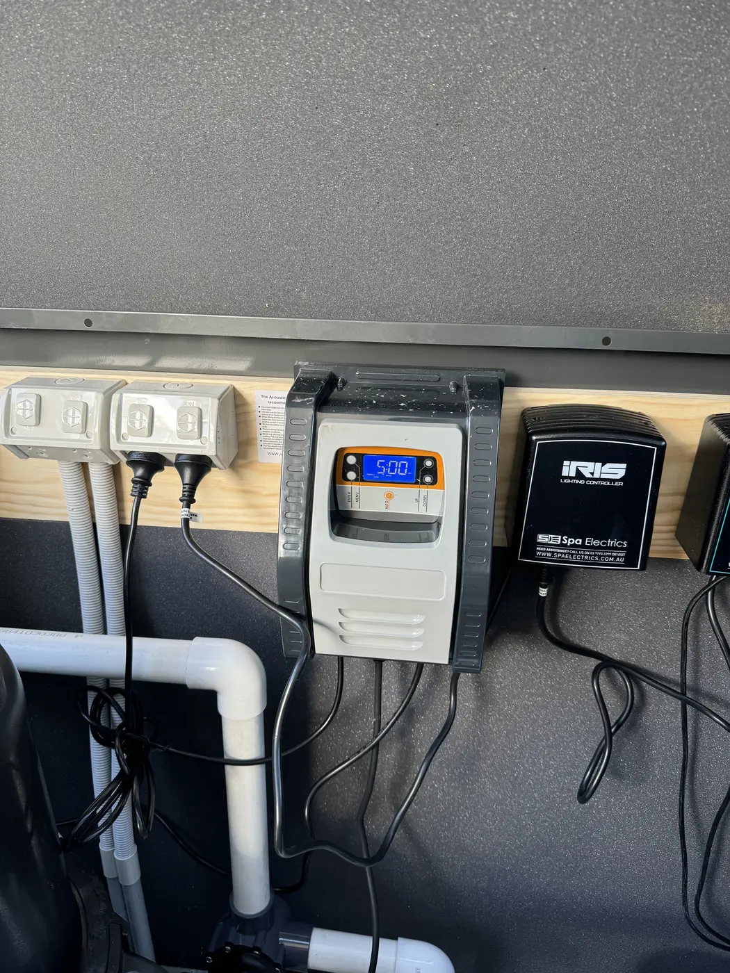 Pool timer and lighting controller mounted on a dedicated equipment wall