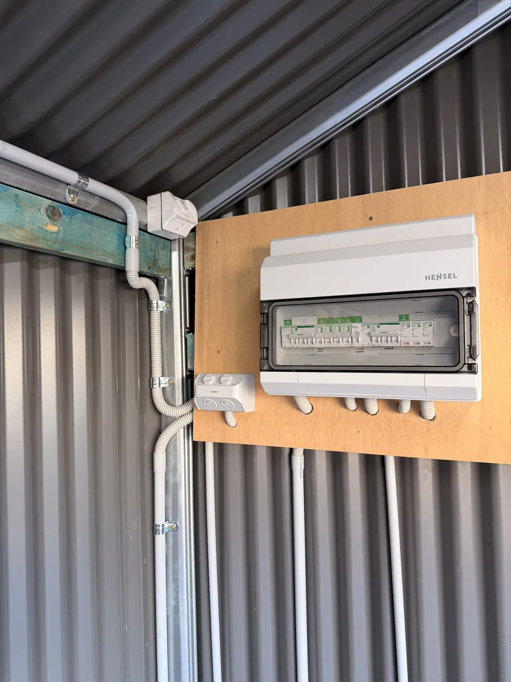 Sub-board with surge protection for pool and outdoor loads